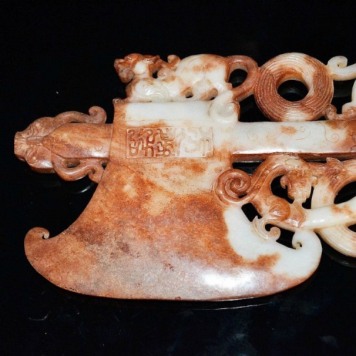 Archaistic Carved Ritual Ax in White and Russet Jade. Photo courtesy Gianguan Auction, via Alai