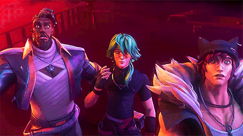 As K'Sante and Sett start running from something offscreen, Ezreal stays put and pulls down his sunglasses in shock