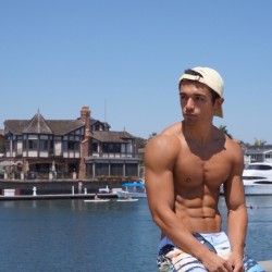 itsswimfever:  Tanned muscled stud dockside…