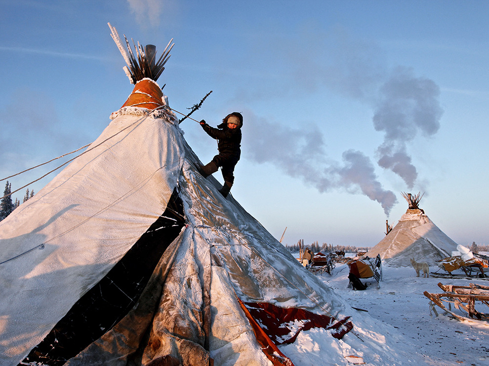 natgeotravel: A Nenets child climbs his family’s tent, making for an unusual playground in