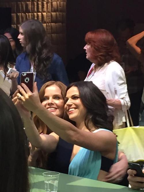 Rebecca Mader copping a feel taking selfies with Lana Parrilla at San Diego Comic Con 2015.