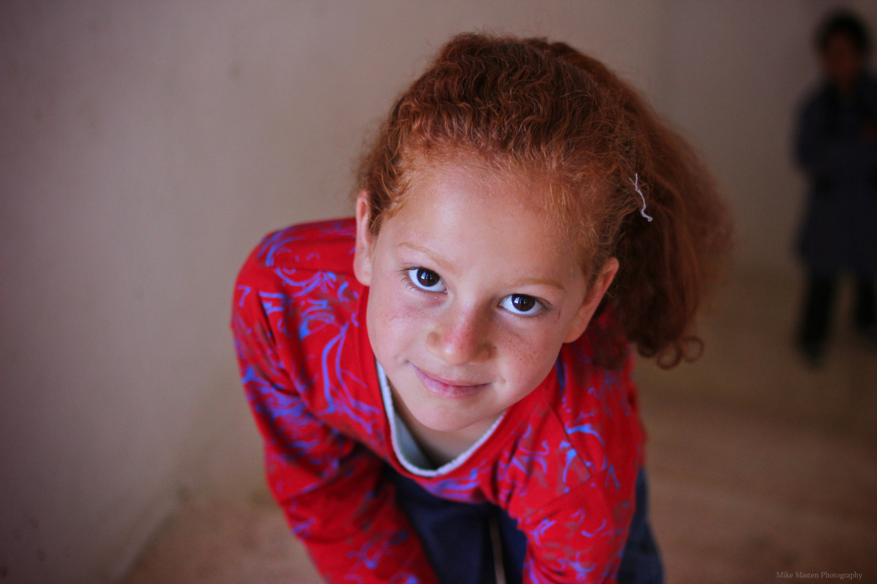 Syrian refugee child with bright red hair in Jordan. May 2014.