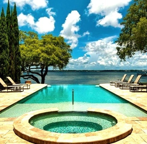 Pool MiamiAn Illustration Of A Large Traditional Backyard Tile With A Rectangular Infinity Hot Tub