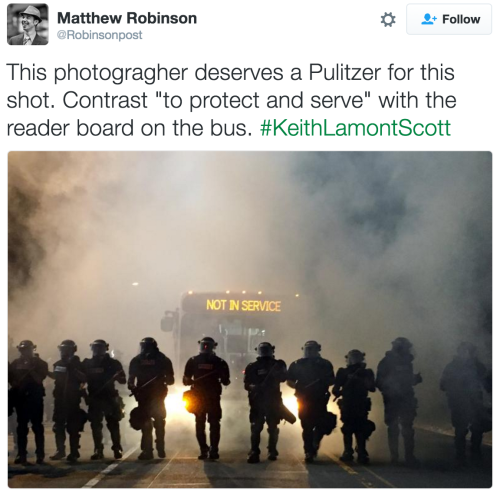 “This photographer deserves a Pulitzer for this shot. Contrast &ldquo;to protect and serve