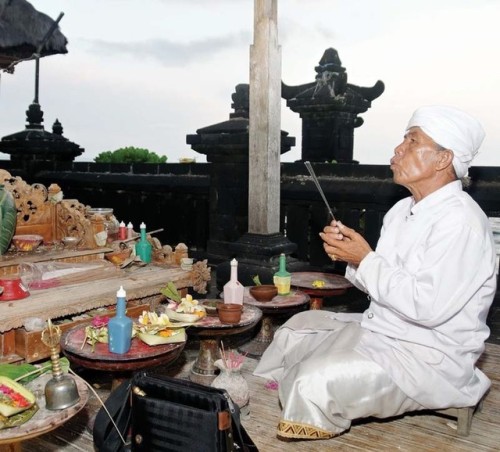 Brahmana priest making offerings, Bali