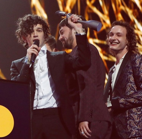 the1975hqs: The 1975 accepting the award for Best British Band