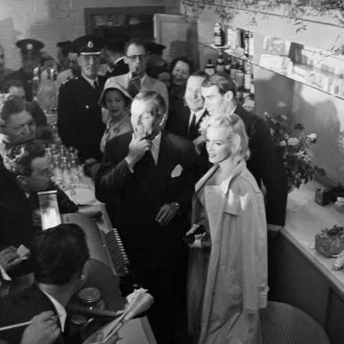 infinitemarilynmonroe:  Marilyn Monroe and Arthur Miller being greeted in England by Laurence Olivier, Vivien Leigh, and the press, 1956.