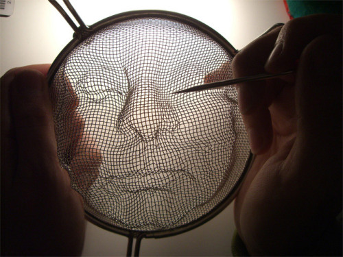 euo:  Isaac Cordal: faces are modeled into metal kitchen strainers 