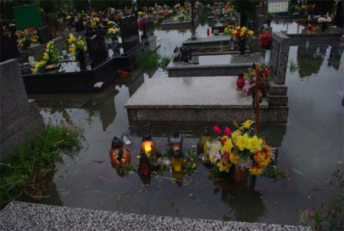 sixpenceee:  A flooded cemeeary located in Brzeszcze, Poland. 