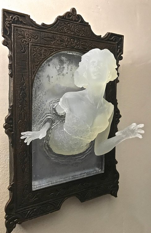 sixpenceee:  8.5" sculpture of a Victorian ghost emerging from an antique mirror cast in resin. Link