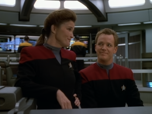 A Conversation On The Bridge Between Janeway, Tom, Chakotay And Tuvok. Tuvok Makes A Comment About Human