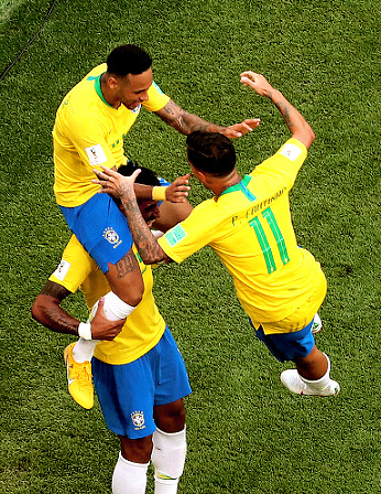 gerrard-pique:  Neymar of Brazil celebrates scoring a goal to make it 1-0 with Paulinho and Philippe