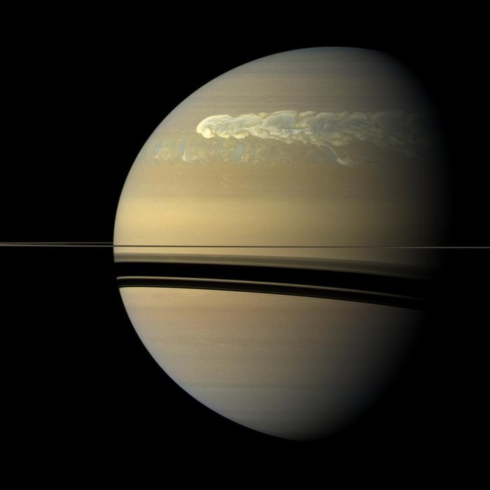 astronomyblog:  Saturn’s atmosphere exhibits a banded pattern similar to Jupiter’s,