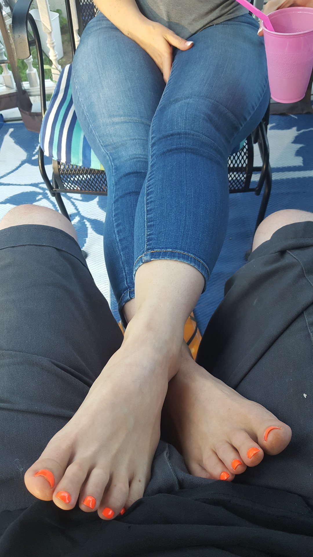 myprettywifesfeet:  My pretty wifes sexy feet in my lap relaxing on the deck after