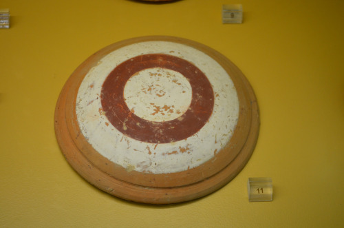 greek-museums: Archaeological Museum of the Stoa of Attalos: A shield and a plaque with a female fig
