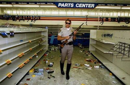 equestrianrepublican:  trunk-slamchest:  cerebralzero:  colonel-kurtz-official:  A California Highway patrolman in a looted store, 1992.  You sure this isn’t one of the village people.  Young man, there’s no need to feel down I said young man, takes