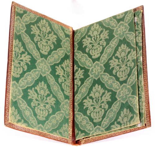 An unusual elaborate gilt binding which shows a gilt coat of arms of Louis XV?dating from the mid 18