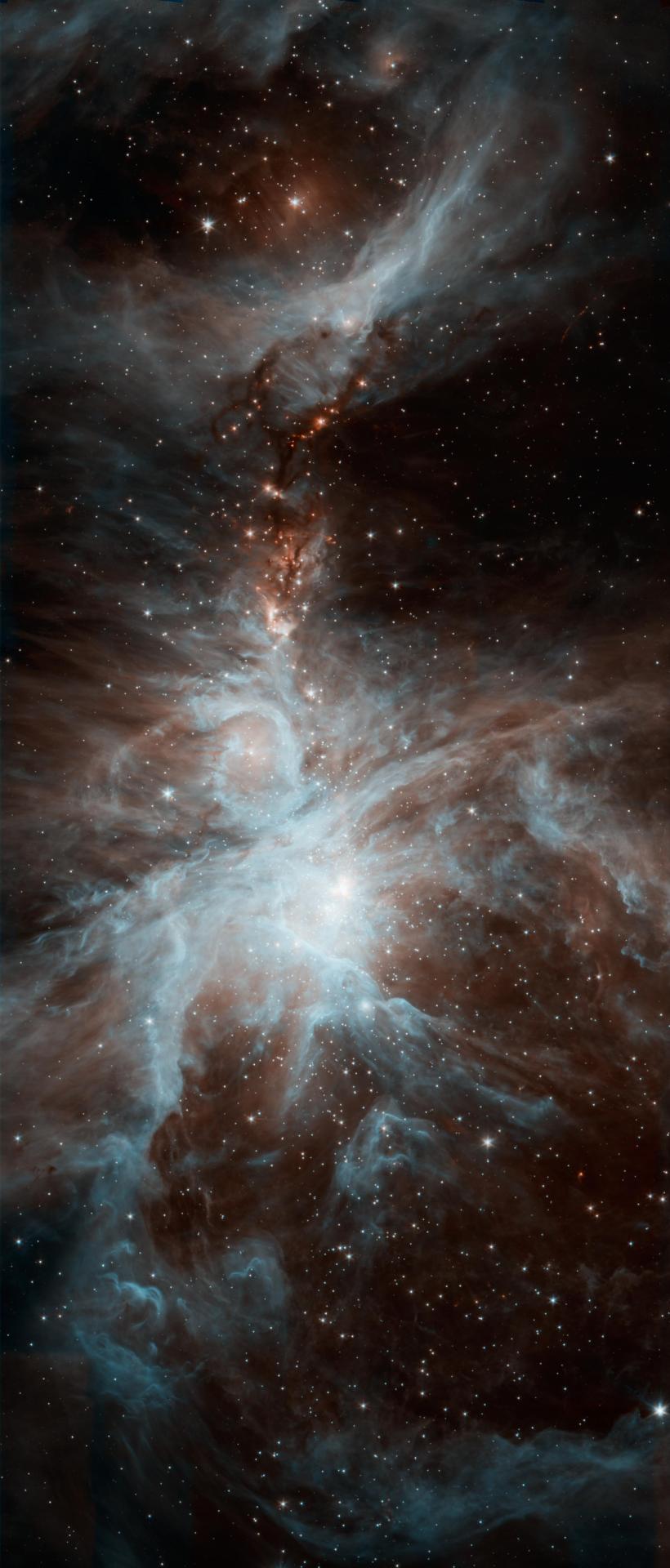A Colony Of Hot, Young Stars Is Stirring Up The Cosmic Scene In This New Picture From NASA's Spitzer