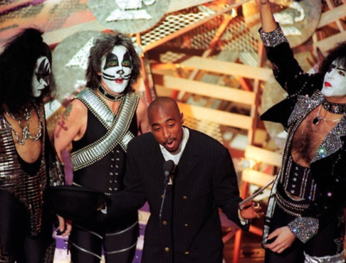 twixnmix:       Tupac and Kiss at the 38th Annual Grammy Awards on February 28, 1996.  This was the first time the original lineup of Kiss appeared in public together in full makeup since December 1979. They presented the award for Best Pop Performance