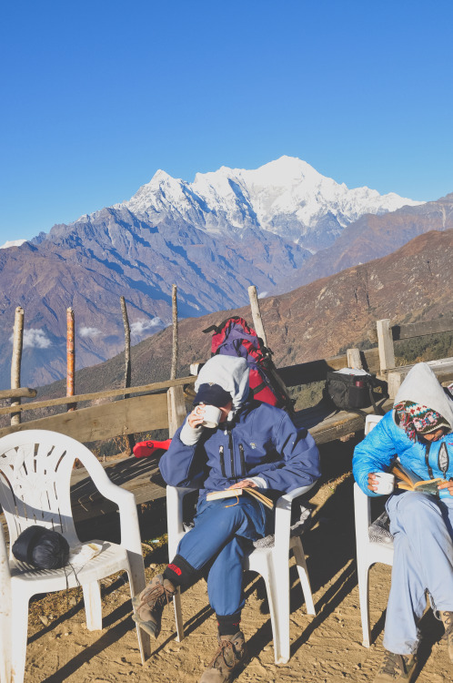 Chiya (tea), books, and sunshine at the top of the mountain. Freezing cold but the view of the Himal