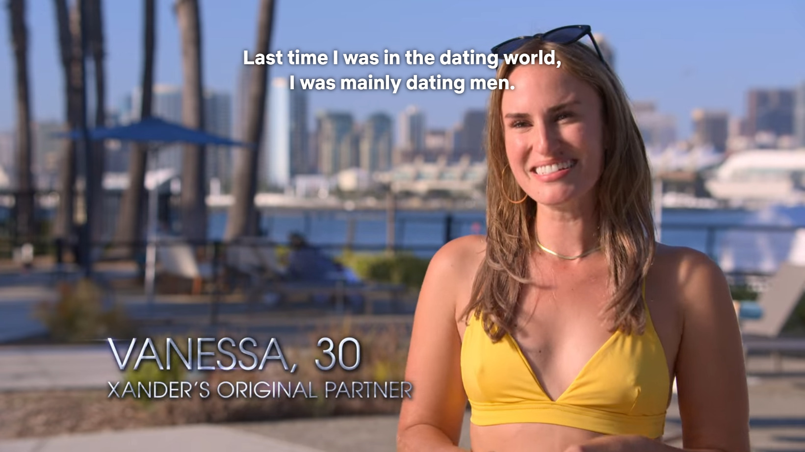 Vanessa stands by the pool and says "Last time I was in the dating world, I was mainly dating men."