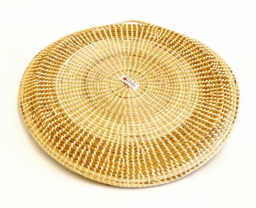 Sweetgrass rice fanner with pine knotsMultiple views of a circular, flat sweetgrass basket with a ha