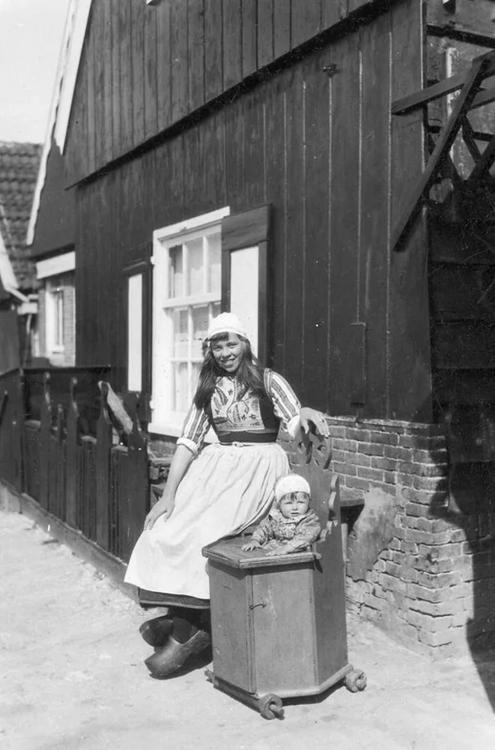 paolo-streito-1264:  Young Dutch mother with her baby in a wooden pram, the Netherlands, 1929. 