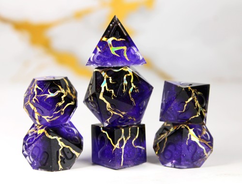 transmutationdice: Beholden.A sparkly purple and black set with gold holographic lightning. Num