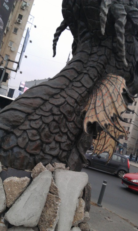 just-another-leaf-in-the-wind:beguilingblackness:Smaug The Sculpted, from Unirii (Union) Square in B