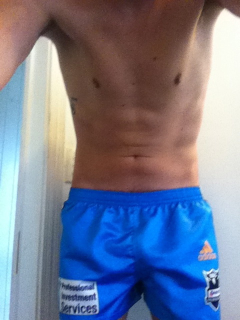 adidaslad:This guy is so hot!!  Love wet footy shorts!