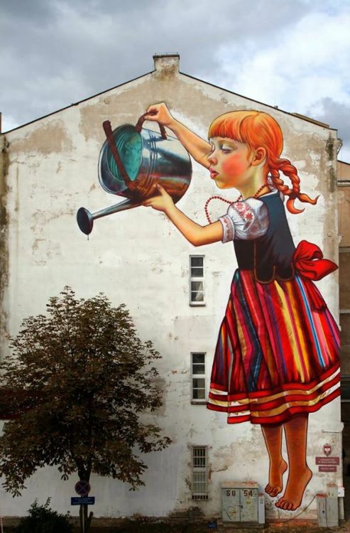 A giant girl waters a tree - Natalia Rak - Bialystok (Poland)