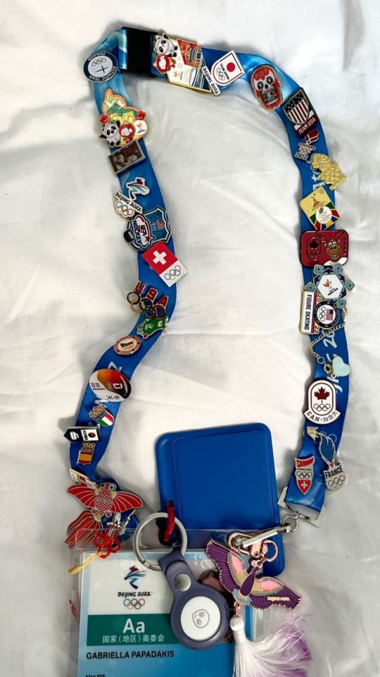 Gabi's olympic lanyard with many many pins