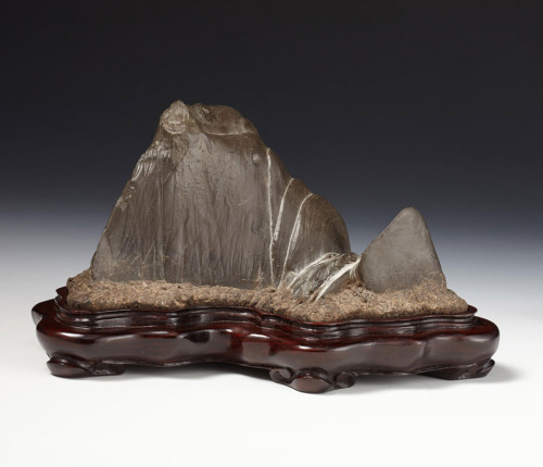 japaneseaesthetics:Suiseki or scholar’s stone in the form of a mountain peak with snowy seams, the o