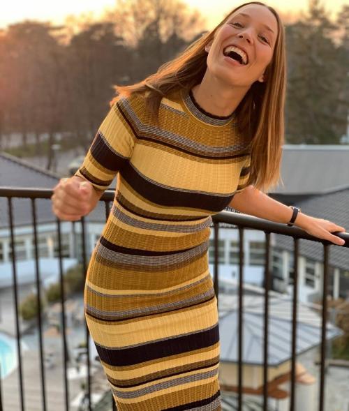 Happy girl in a tight, ribbed dress