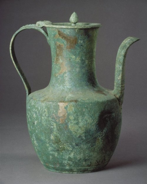 Dated c. 12th-3th century, this Goryeo Dynasty Korean pitcher, or ewer, is made of bronze. Many Gory
