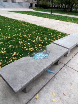 jazzmanisineffect:  archiemcphee:   You see a lot of stress-eating on campus this time of year.  Om nom nom nom! Artist David Zinn, aka Sluggo (previously featured here), recently discovered a ravenous blue chalk monster feasting on a concrete bench in