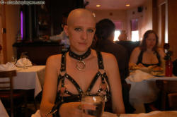 bondage-ponygirls-and-more:  Bald Naked (mostly) slave girl in public restaurant (Ivy Breann)