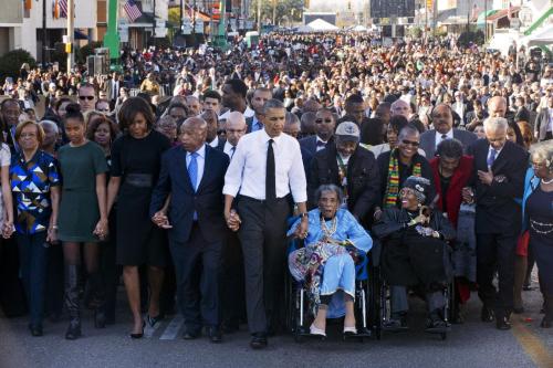 celebritiesofcolor:  President Barack Obama, first lady Michelle Obama, Malia and Sasha as well as members of Congress and civil rights leaders make a symbolic walk across the Edmund Pettus Bridge, Saturday, March 7, 2015, in Selma, Ala