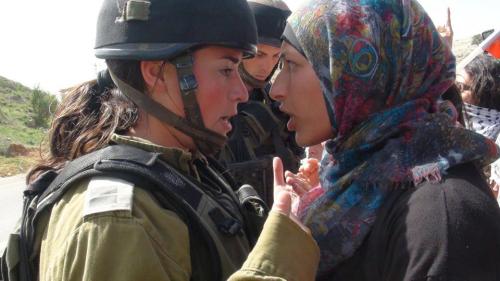 the-uncensored-she:androphilia:  “LOOK INTO MY EYES AND GET OUT OF MY LAND!“ (via Johayna جهينة خالدية)  A Palestinian woman facing off against a piece-of-shit IDF soldier. Western feminists need to STOP heralding female IDF soldiers