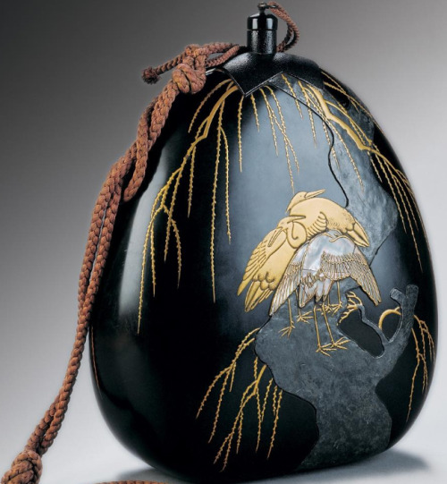 japaneseaesthetics:  A water flask for use when travelling . wood covered with natural lacquer, decorated with techniques of hiramakie, takamakie, sabiage a raden, inlaid with plumb and furnished with silk cords .   18th Century - 19th Century; around