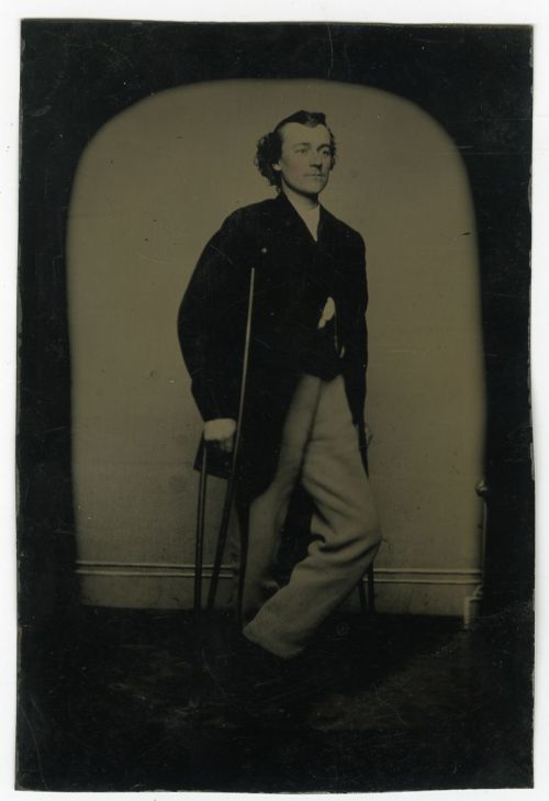 ca. 1860-1880s, [tintype portrait of a man on crutches]