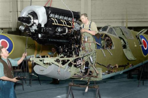 Colourized photos of Spitfire planes during WW2:An RAF Spitfire sails above the clouds on the Britis