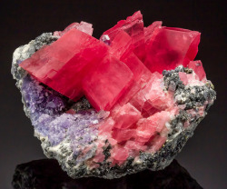 vugnasmineralblog:   Rhodochrosite with purple Fluorite,  Quartz, and Sulfides   Nate’s Pocket,  Sweet Home Mine, Alma, Colorado  