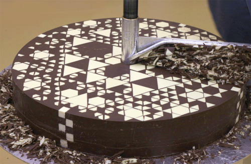 itscolossal:  Hidden Geometric Patterns Gradually Revealed inside Giant Chocolate Cylinder