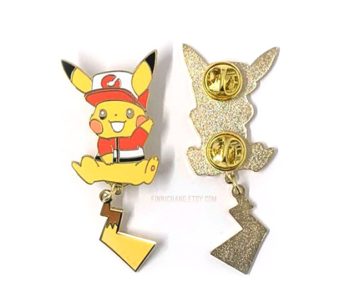 Store update!! → finnichang.etsy.comLet’s Go outfit inspired Pikachu and Eevee enamel pins with dang