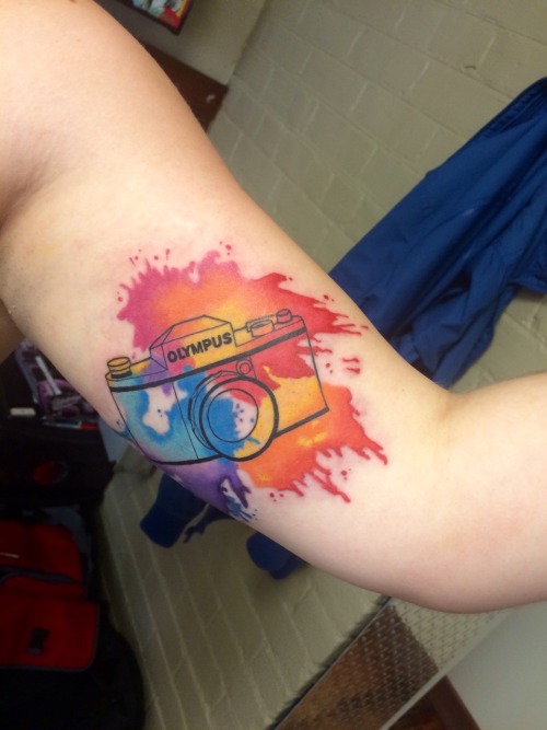 fuckyeahtattoos:  Done by Gao Feng at Off the Map Tattoo in Easthampton, MA.  “Some dude spilled ink all over your camera, gal.” 