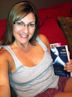 thighhighlover:  denamilf:  Mommy reading “50 Shades of Grey”.  Mommy needs a spanking…;)