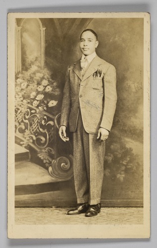 Photographic postcard of an unidentified man in a suit, 1926-1940s, Smithsonian: National Museum of 