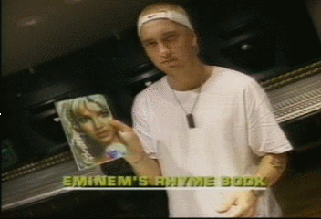 shady-god:eminem with his britney spears notebook 