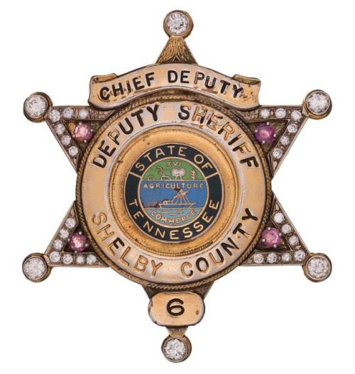 Elvis Presley’s diamond and ruby studded deputy sheriff’s badge.Sold at Auction: $40,250from R